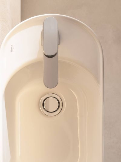 Roca MERIDIAN Компактен асиметричен умивалник Fineceramic® 50 x 27,5 см, бял гланц